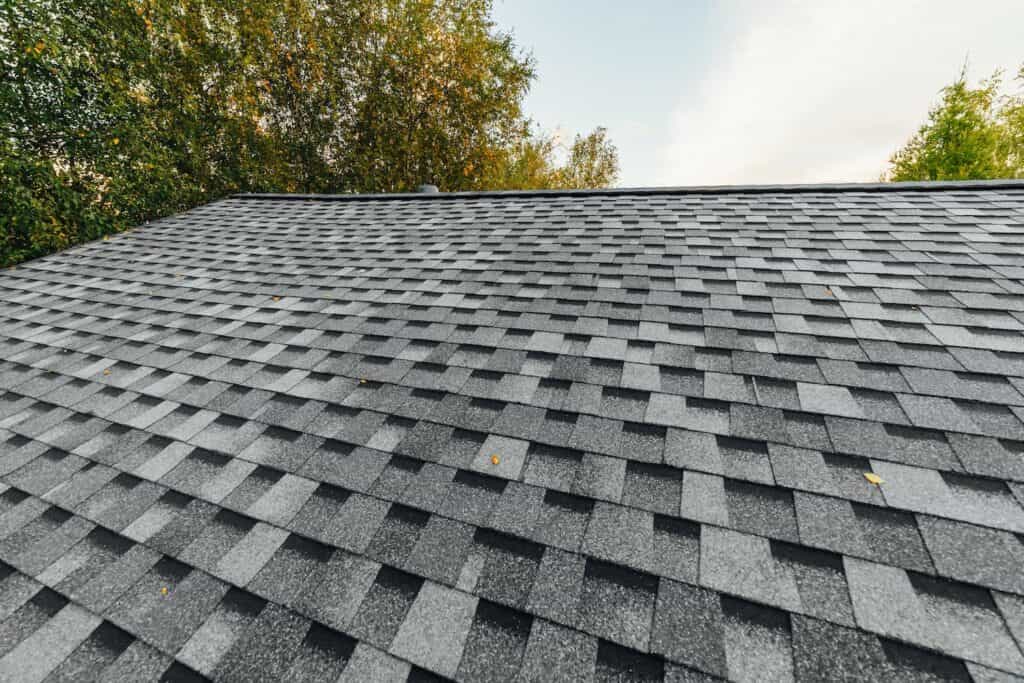 iko dynasty vs. cambridge shingles up close slanted view of new asphalt shingle roof installation